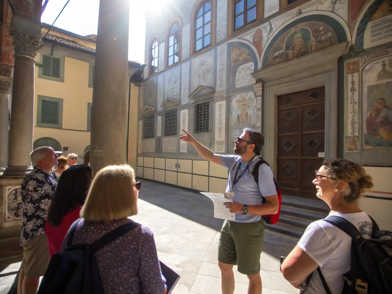 A photograph of a guided tour group exploring the interior of Notre Dame de Lavera, with a knowledgeable guide sharing historical insights and architectural details.